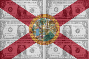 Image of the Florida State Flag with Dollar Bills in the Background